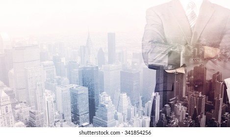 Business Man Standing On Roof With City View In The Background