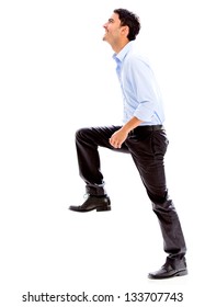 Business Man Stepping Up For Success - Isolated Over A White Background