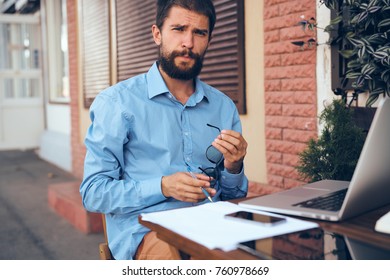  business man in a street cafe                               - Shutterstock ID 760978669