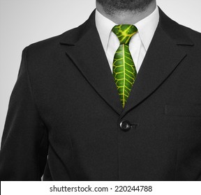 business man in suit with green collar, for environment protection or environmental friendly business