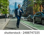 Business man in suit run in NY. American business. Businessman run down street, late for a meeting. Businessman in suit run be success. Running business man. Fast business. Run and late businessman.