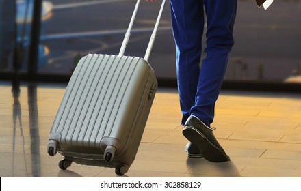 Business Man With Suitcase In Hall Of Airport