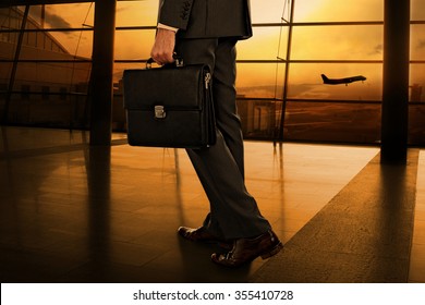 Business Man With Suitcase In Hall Of Airport