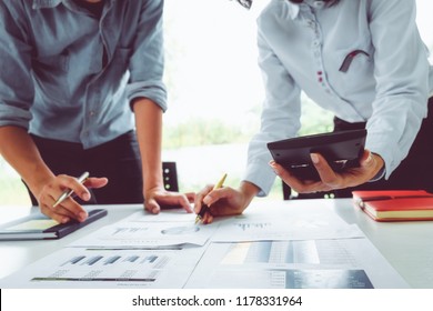 Business man supervising and secretary to execute business plan and consultant analyzing company annual financial report balance sheet statement working with documents graphs. Audit and consultant - Shutterstock ID 1178331964
