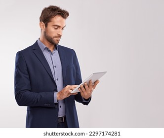 Business man with tablet, technology or corporate communication isolated on studio background. Internet, connectivity or networking professional, male worker or check email for career on mockup space - Shutterstock ID 2297174281