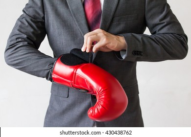 Business Man Taking Off Their Boxing Gloves As He Gives Up On Tasks