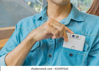 Business Man Taking Smart Phone In Shirt Pocket