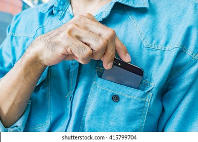 Business Man Taking Smart Phone In Shirt Pocket