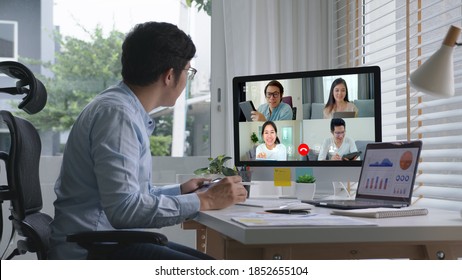 Business Man Talking About Sale Report In Video Conference.Asian Team Using Laptop And Tablet Online Meeting In Video Call.Working From Home, Working Remotely And Self Isolation At Home