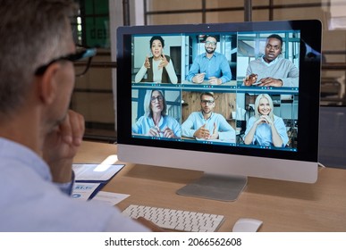 Business Man Talking With Diverse Team People Having Digital Group Video Call Global Conference Working Leading Online Virtual Meeting Training On Pc Computer. Over Shoulder Videocall Screen View