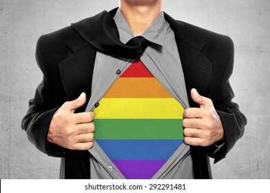 Business Man Tears Open His Shirt In A Super Hero Fashion Getting Ready To Save The Day. LGBT Freedom Conceptual