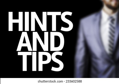 Business man with the text Hints and Tips in a concept image