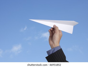 Business Man Throwing A Paper Plane