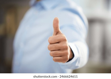 Business man, thumbs up and motivation in office, support and promotion or agreement in like emoji. Male person, yes and employee satisfaction for career opportunity, winner and thank you gesture - Powered by Shutterstock