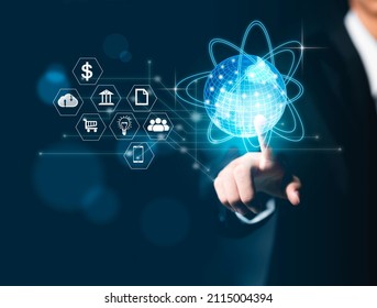 A business man touches a screen like a globe with his finger. globe concept with network threads surrounded with internet of things icons.Business communications, finance, banking and global networkin