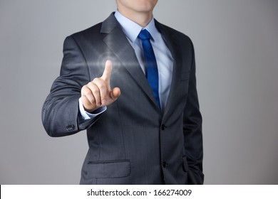 Business man touching an imaginary screen - Powered by Shutterstock