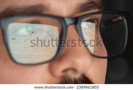 Business man trader broker analyst investor analyzing stock exchange trade crypto financial market looking at computer screen wearing glasses with stockmarket digital chart reflection, close up view.