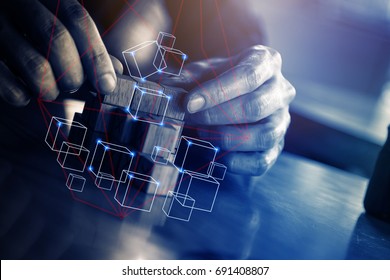 business man try to build wood block on wooden table and blur background business  organization startup concept  - Shutterstock ID 691408807