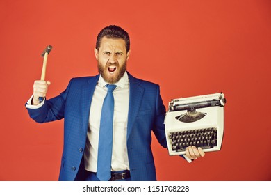 business man with typewriter, aggressive businessman hold hammer on red background, failure and challenge, crisis and problem, stress and overtime