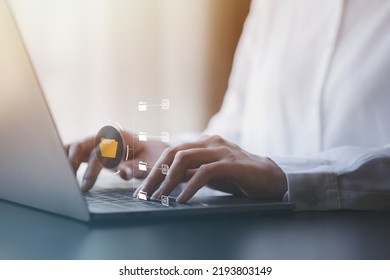 business man typing on a keyboard with holograms of digital document files, data files on computers stored as cloud databases can be viewed online and prevented data loss from the device. - Shutterstock ID 2193803149