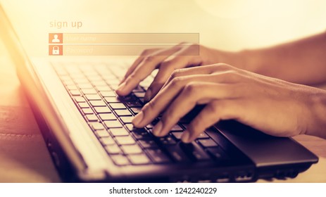 Business man use notebook computer Sign Up or log in Username Password (concept Vintage social media)