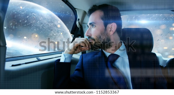 a business man uses a car with autopilot to make
a journey into the future of space. concept of future and high
technology. safe travels