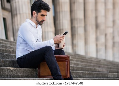Business Man Using His Mobile Phone Outdoors.
