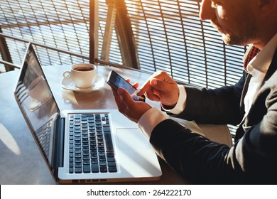 Business Man Using Internet On  Smart Phone And Laptop