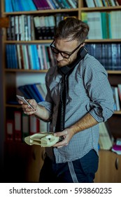 Business Man Using Land Line Phone 