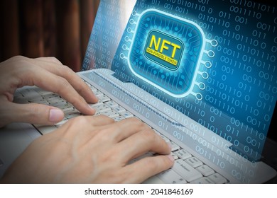 Business man using laptop computer invest and pay for unique collectibles in games or art, NFT non fungible tokens concept - Shutterstock ID 2041846169