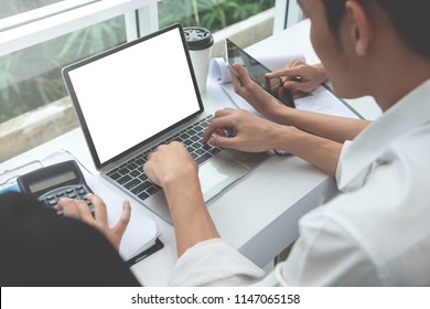 Business man is using the laptop with muck up white screen - Shutterstock ID 1147065158