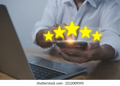 Business Man Using Mobile Smart Phone And Laptop Computer With Five Star Button To Review Good Rating, Digital Marketing, Good Experience, Customer Product Rating Review, Customer Feedback Concept