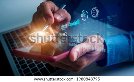 Business man using mobile update tasks with VR financial chart scheduling virtual diagram and milestones progress planning, pen pointing on top of mobile.