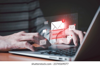 Business man using smartphone and computer that show warning sign after got attack phishing email by malware from hacker that commit cyber crime or software crash to cause an error.