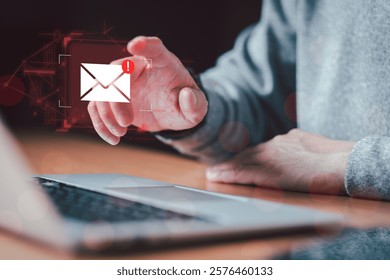 Business man using smartphone and computer that show warning sign after got attack phishing email by malware from hacker that commit cyber crime or software crash to cause an error.