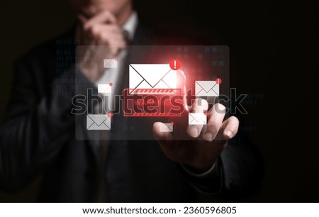 Business man using smartphone and computer that show warning sign after got attack phishing email by malware from hacker that commit cyber crime or software crash to cause an error.