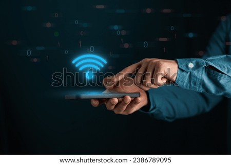 Business man using smartphone,with wifi icon,business communication social network concep,Security BYOD Business concept