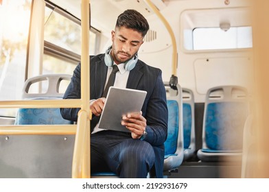 Business man, using tablet and bus for travel to work, home or working location. Relax businessman using headphones, public transport to cbd and mobile device to update social media or check - Powered by Shutterstock