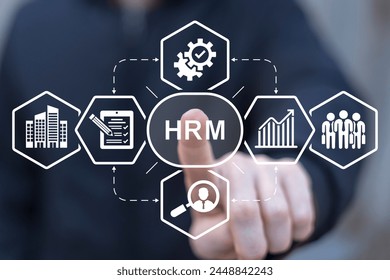 Business man using virtual interface sees acronym: HRM. Human Resource Management ( HRM ) Business concept. Human development recruitment leadership and customer target concept.