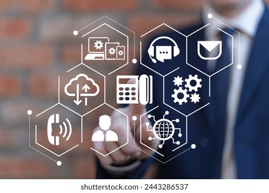 Business man using virtual touch screen presses icon: IP telephone. Concept of VOIP telecommunication. IP telephony and connection line web technology.