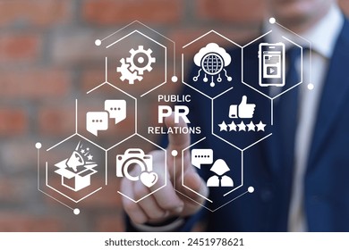 Business man using virtual touch screen clicks text: PR PUBLIC RELATIONS. PR Public Relations concept. Communication advertising marketing strategy. PR or media relations or marketing and publicity.
