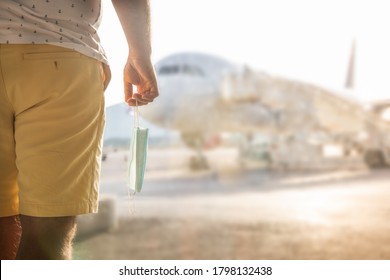 A Business Man Is Waiting At The Airport For An Airplane