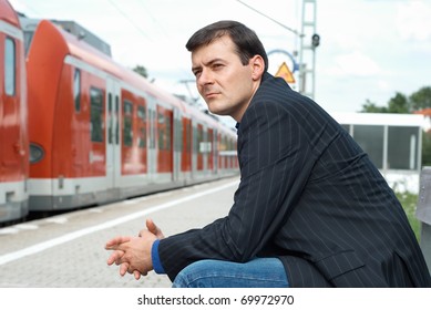 Business man waiting for a train