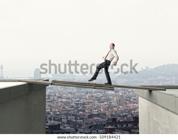 business man walk on
danger improvised
bridge