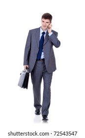 Business Man Walking Forward While Talking On The Phone Over White