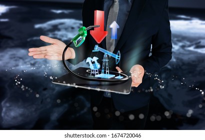 Business man  are at war over oil prices, arrows showing  down Oil pump-jacks on tablet. - Shutterstock ID 1674720046
