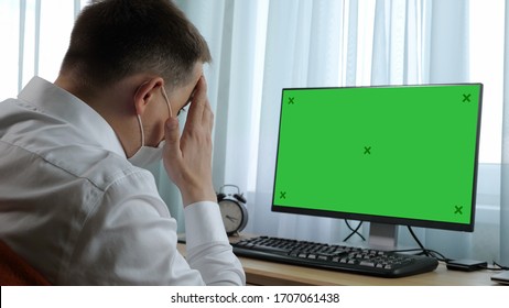 Business man watching news on his computer. Green Screen Mock-up - Powered by Shutterstock