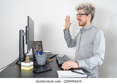 Business Man Waving Hands At Computer While Working At The Office. New Communication Concept. White Background