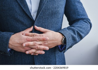 Business Man Wearing Blue Tweed Blazer Holding Hands In A Lock, Close-up.