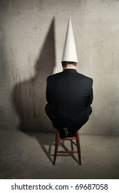 Business Man Wearing A Dunce Cap